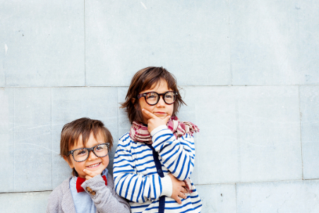 2 children wearing eyeglasses